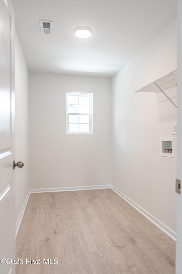 481 Peggy Mill Rd, Hamlet, NC 28345 - laundry area with hookup for a washing machine and light wood-style flooring