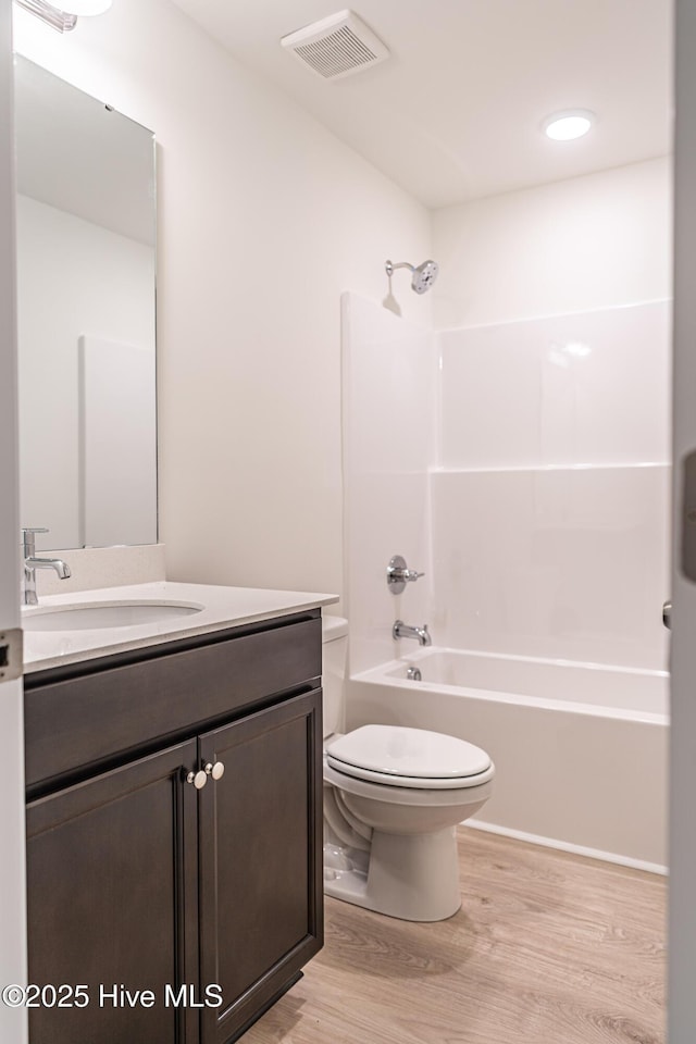 481 Peggy Mill Rd, Hamlet, NC 28345 - full bath with wood finished floors, vanity, and washtub / shower combination