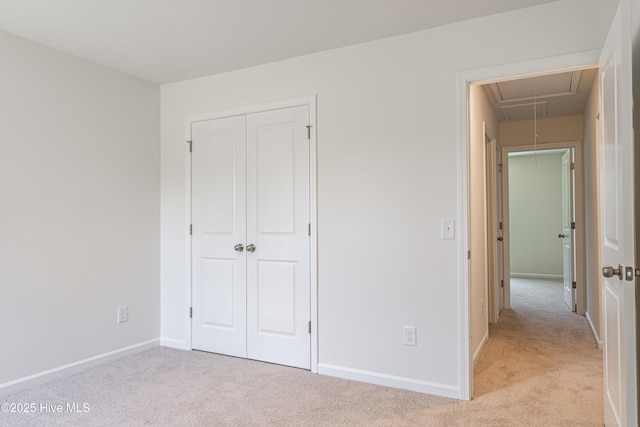 481 Peggy Mill Rd, Hamlet, NC 28345 - unfurnished bedroom featuring attic access, light colored carpet, and a closet