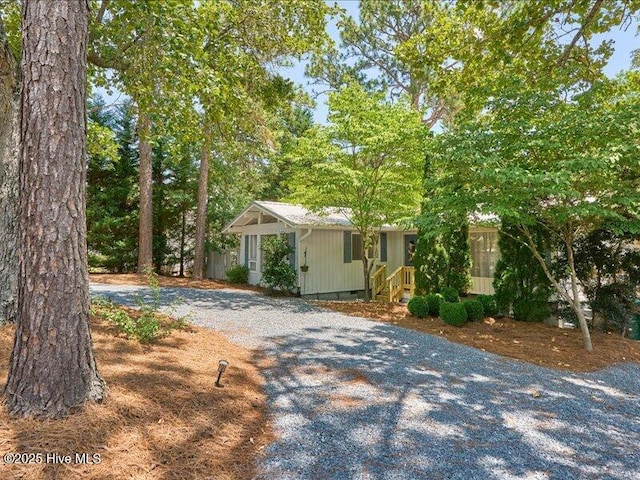 2670 Longleaf Dr SW, Pinehurst, NC 28374 - view of front of home featuring gravel driveway and crawl space