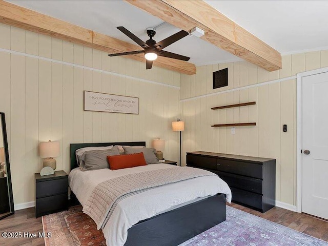 2670 Longleaf Dr SW, Pinehurst, NC 28374 - bedroom with beam ceiling, wood finished floors, and a ceiling fan