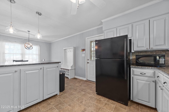 116 Waterside Dr, Bath, NC 27808 - kitchen with black appliances, crown molding, white cabinets, pendant lighting, and dark stone counters