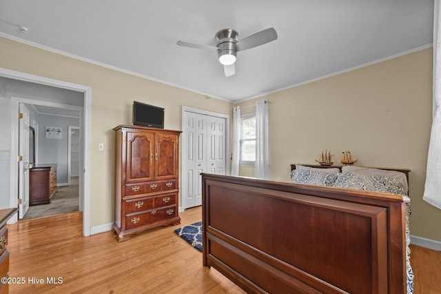 116 Waterside Dr, Bath, NC 27808 - bedroom featuring ornamental molding, light wood finished floors, a closet, and ceiling fan