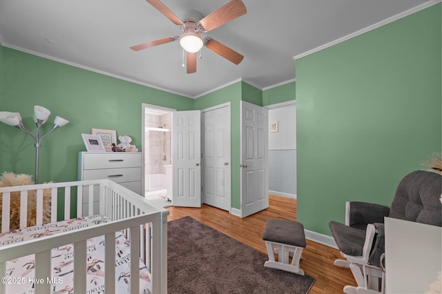 116 Waterside Dr, Bath, NC 27808 - bedroom featuring crown molding, wood finished floors, ensuite bathroom, ceiling fan, and a closet