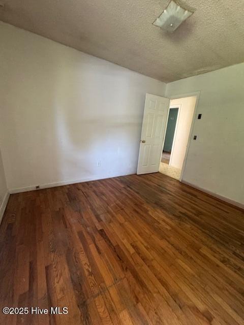 1522 Parson Grove Church Rd, Wadesboro, NC 28170 - unfurnished room featuring wood finished floors and a textured ceiling