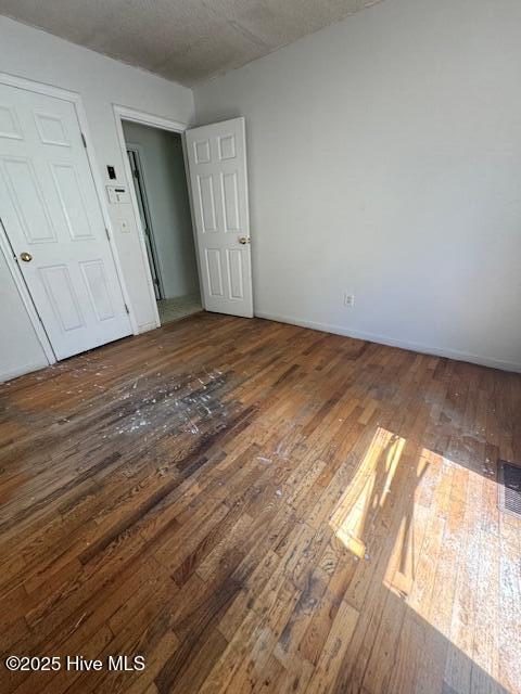 1522 Parson Grove Church Rd, Wadesboro, NC 28170 - spare room featuring hardwood / wood-style flooring and a textured ceiling