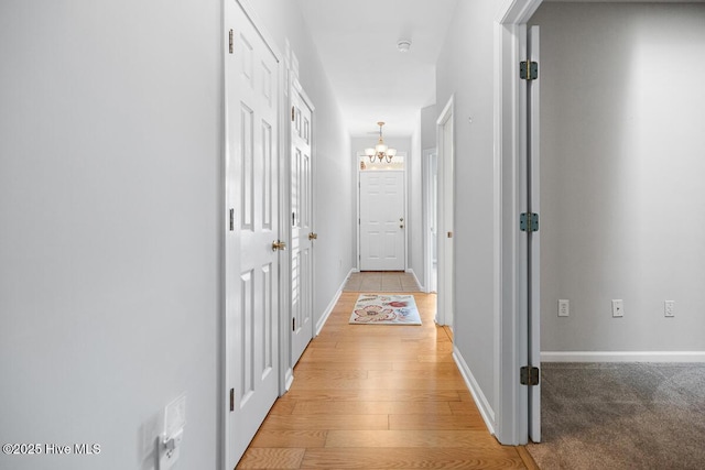 826 Shelton Ct, Wilmington, NC 28412 - hall featuring a chandelier and light wood-style floors