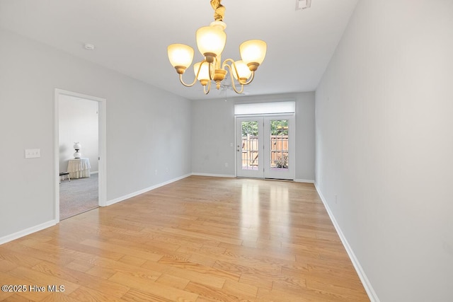 826 Shelton Ct, Wilmington, NC 28412 - empty room with a chandelier and light wood-style flooring