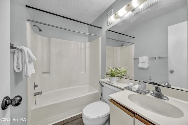 400 Virginia Ave Unit 203B, Carolina Beach, NC 28428 - full bath with vanity, bathtub / shower combination, a textured ceiling, and wood finished floors