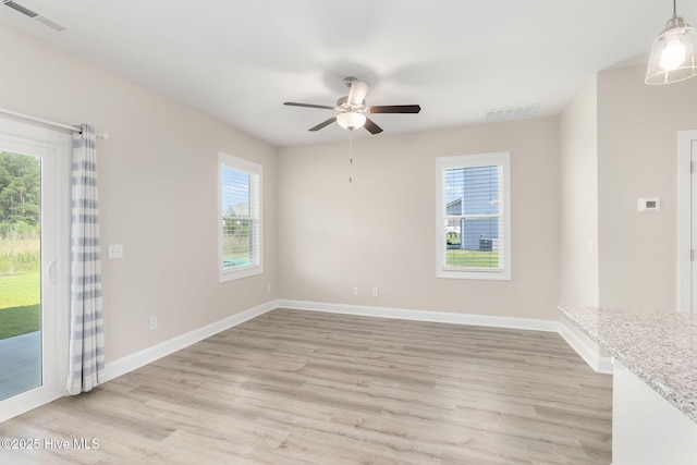 107 Pasture Ln Unit B, Swansboro, NC 28584 - spare room with plenty of natural light, light wood-type flooring, and ceiling fan