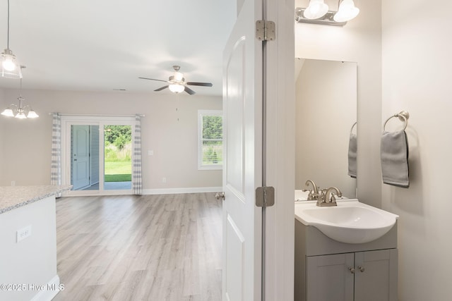107 Pasture Ln Unit B, Swansboro, NC 28584 - bathroom featuring vanity, a ceiling fan, and wood finished floors