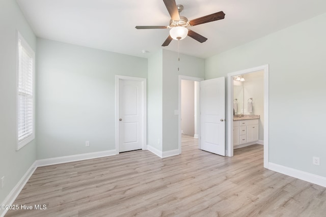 107 Pasture Ln Unit B, Swansboro, NC 28584 - unfurnished bedroom with light wood finished floors, connected bathroom, and a ceiling fan