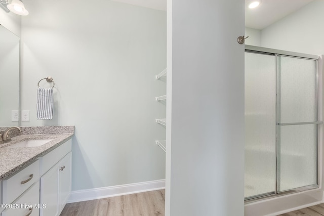 107 Pasture Ln Unit B, Swansboro, NC 28584 - bathroom with vanity, wood finished floors, and a shower stall
