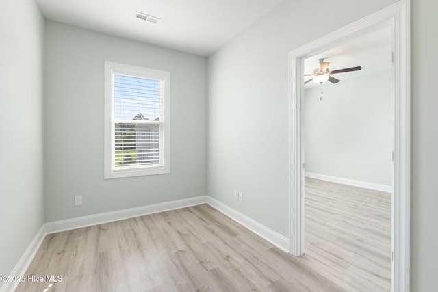107 Pasture Ln Unit B, Swansboro, NC 28584 - empty room with wood finished floors and a ceiling fan