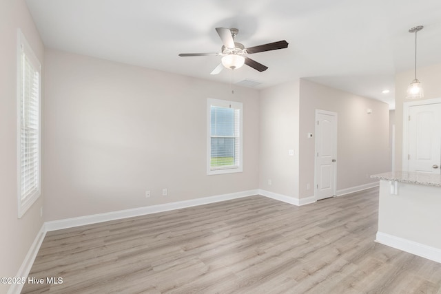 107 Pasture Ln Unit B, Swansboro, NC 28584 - spare room with light wood-type flooring and ceiling fan