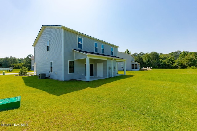 107 Pasture Ln Unit B, Swansboro, NC 28584 - rear view of house with a lawn and a patio
