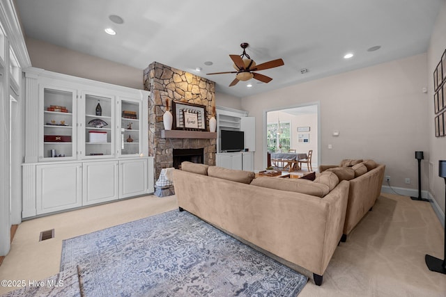 106 Blue Heron Cir, Sneads Ferry, NC 28460 - living area with a ceiling fan, light colored carpet, a stone fireplace, and recessed lighting