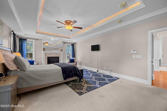 106 Blue Heron Cir, Sneads Ferry, NC 28460 - bedroom featuring a raised ceiling, a fireplace, ornamental molding, carpet floors, and ceiling fan