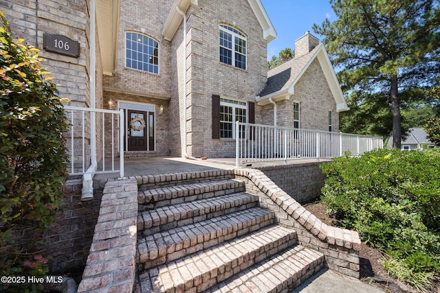 106 Blue Heron Cir, Sneads Ferry, NC 28460 - entrance to property featuring brick siding and a chimney