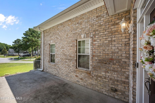 106 Blue Heron Cir, Sneads Ferry, NC 28460 - view of home's exterior with brick siding and a yard
