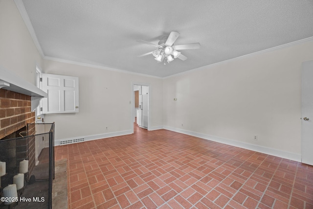 1902 York St, Kinston, NC 28504 - unfurnished living room featuring brick patterned flooring, a ceiling fan, a fireplace, crown molding, and a textured ceiling