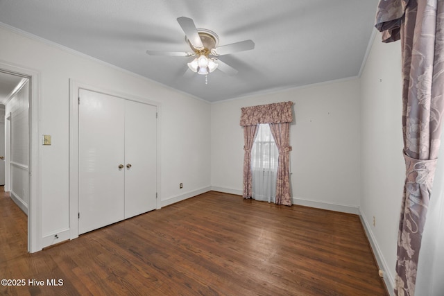 1902 York St, Kinston, NC 28504 - unfurnished bedroom with wood finished floors, crown molding, ceiling fan, and a closet