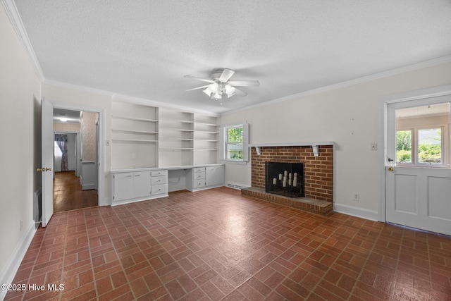 1902 York St, Kinston, NC 28504 - unfurnished living room with brick patterned floors, ceiling fan, built in desk, ornamental molding, and a fireplace