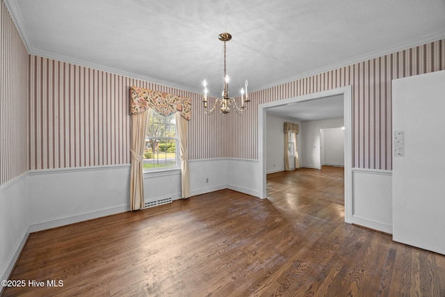 1902 York St, Kinston, NC 28504 - unfurnished room featuring wallpapered walls, a chandelier, ornamental molding, and wood finished floors