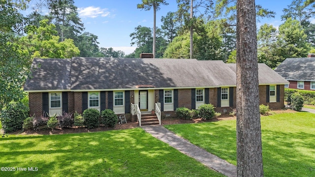 1902 York St, Kinston, NC 28504 - view of front of property featuring brick siding, a front yard, and a shingled roof