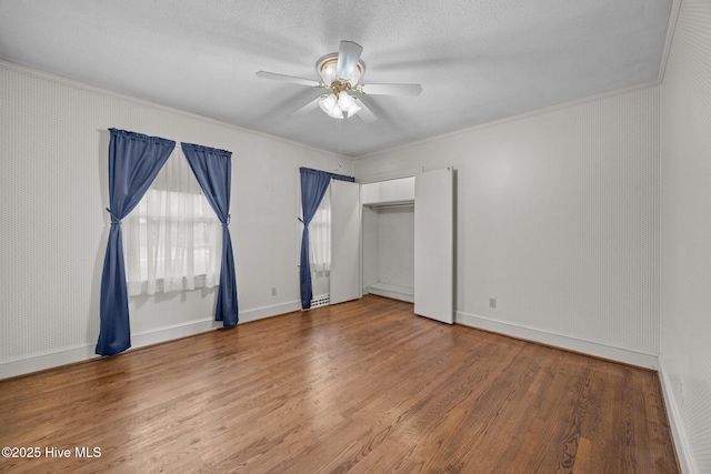 1902 York St, Kinston, NC 28504 - unfurnished bedroom with ornamental molding, wood finished floors, ceiling fan, and a textured ceiling