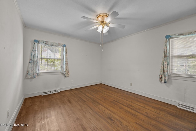 1902 York St, Kinston, NC 28504 - unfurnished room with a ceiling fan, wood finished floors, and crown molding