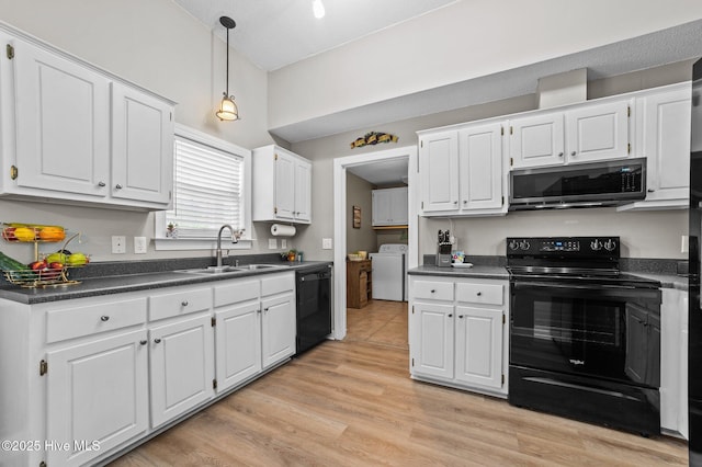 2824 Preston Ln, Grimesland, NC 27837 - kitchen with black appliances, dark countertops, and white cabinets