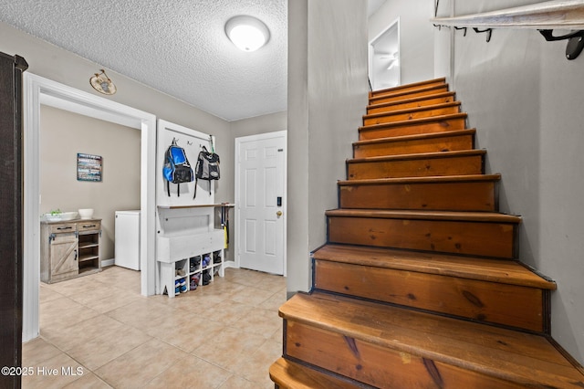 2824 Preston Ln, Grimesland, NC 27837 - stairs with a textured ceiling and tile patterned floors