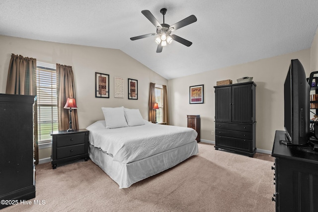 2824 Preston Ln, Grimesland, NC 27837 - bedroom featuring light colored carpet, lofted ceiling, multiple windows, a ceiling fan, and a textured ceiling