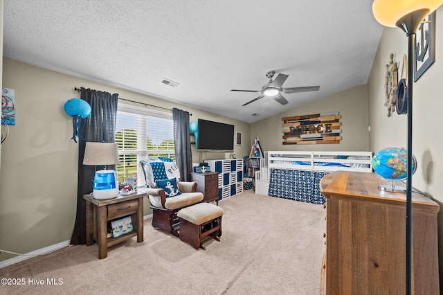 2824 Preston Ln, Grimesland, NC 27837 - carpeted bedroom featuring vaulted ceiling, a textured ceiling, and ceiling fan