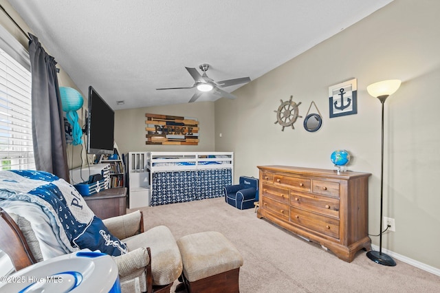 2824 Preston Ln, Grimesland, NC 27837 - carpeted bedroom with lofted ceiling, a ceiling fan, and a textured ceiling