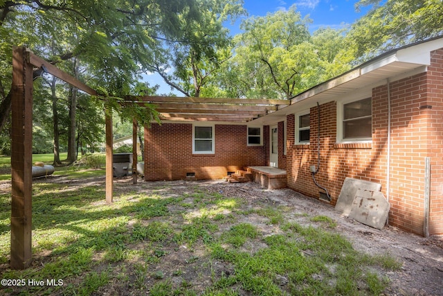 203 James St, Vanceboro, NC 28586 - back of house with crawl space and brick siding