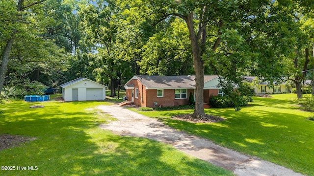 203 James St, Vanceboro, NC 28586 - single story home featuring an outbuilding, brick siding, a garage, and a front lawn