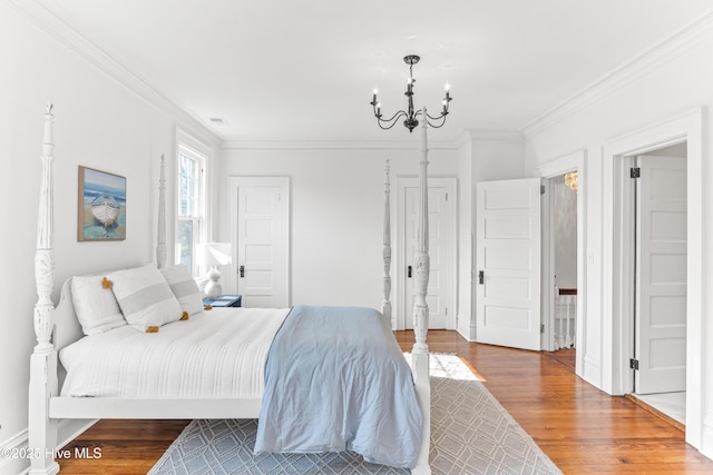 503 S 3rd St, Wilmington, NC 28401 - bedroom with wood finished floors, crown molding, and a chandelier