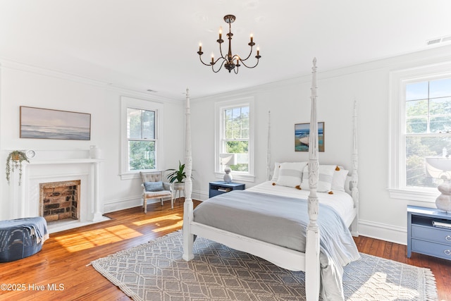 503 S 3rd St, Wilmington, NC 28401 - bedroom with multiple windows, wood finished floors, a chandelier, and crown molding