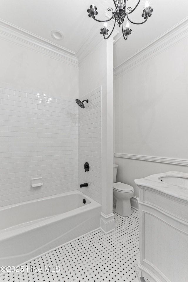 503 S 3rd St, Wilmington, NC 28401 - bathroom featuring ornamental molding, tub / shower combination, vanity, a chandelier, and tile patterned flooring