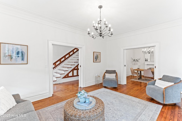 503 S 3rd St, Wilmington, NC 28401 - living room featuring a chandelier, ornamental molding, wood finished floors, and stairway