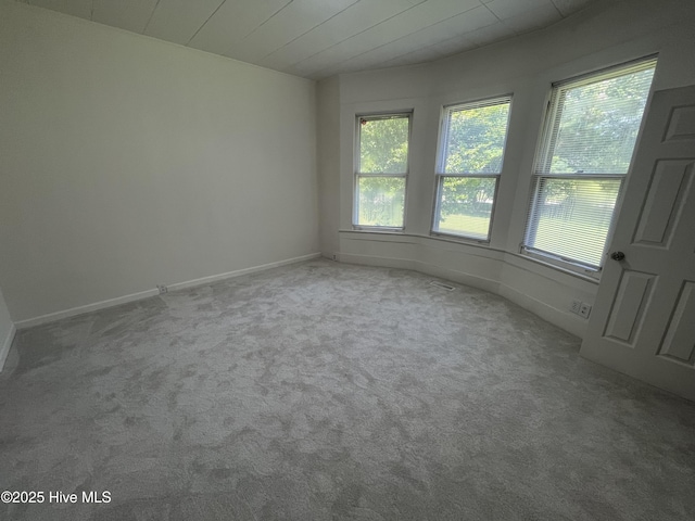 148 N Mitchell Ford Rd, Clarkton, NC 28433 - unfurnished room featuring healthy amount of natural light and carpet flooring