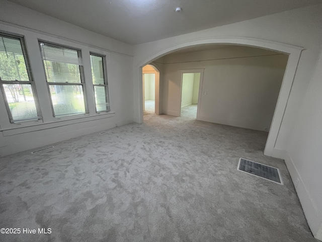 148 N Mitchell Ford Rd, Clarkton, NC 28433 - carpeted empty room with arched walkways
