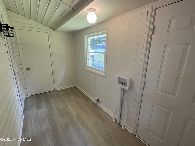 148 N Mitchell Ford Rd, Clarkton, NC 28433 - washroom featuring wood finished floors, washer hookup, and a decorative wall