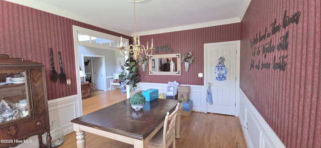 3129 Lake Pointe Trl, Rocky Mount, NC 27804 - dining room with a chandelier, wallpapered walls, crown molding, wainscoting, and light wood-type flooring