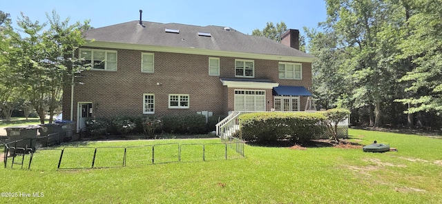 3129 Lake Pointe Trl, Rocky Mount, NC 27804 - rear view of house featuring a chimney, brick siding, and a garage