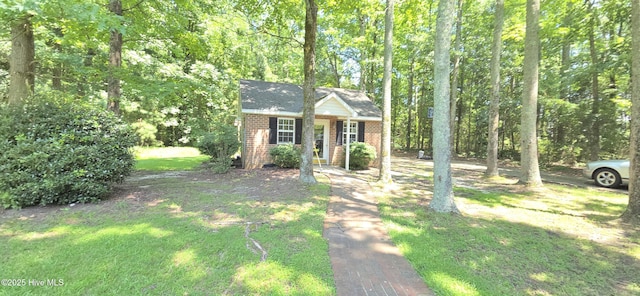 3129 Lake Pointe Trl, Rocky Mount, NC 27804 - view of front facade featuring brick siding, a front lawn, and roof with shingles