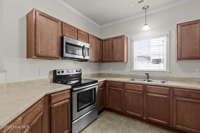 231 Glenhaven Ln, Jacksonville, NC 28546 - kitchen with appliances with stainless steel finishes, light countertops, ornamental molding, decorative light fixtures, and brown cabinetry