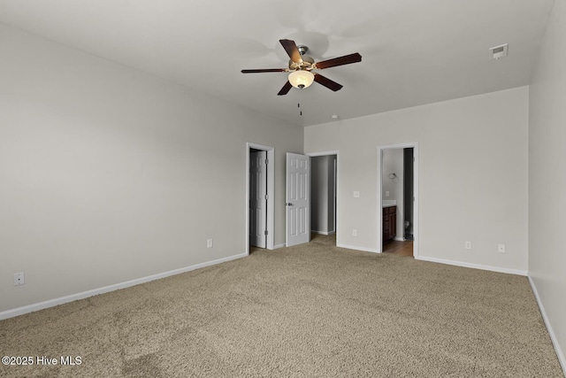 231 Glenhaven Ln, Jacksonville, NC 28546 - unfurnished bedroom featuring carpet, connected bathroom, and a ceiling fan